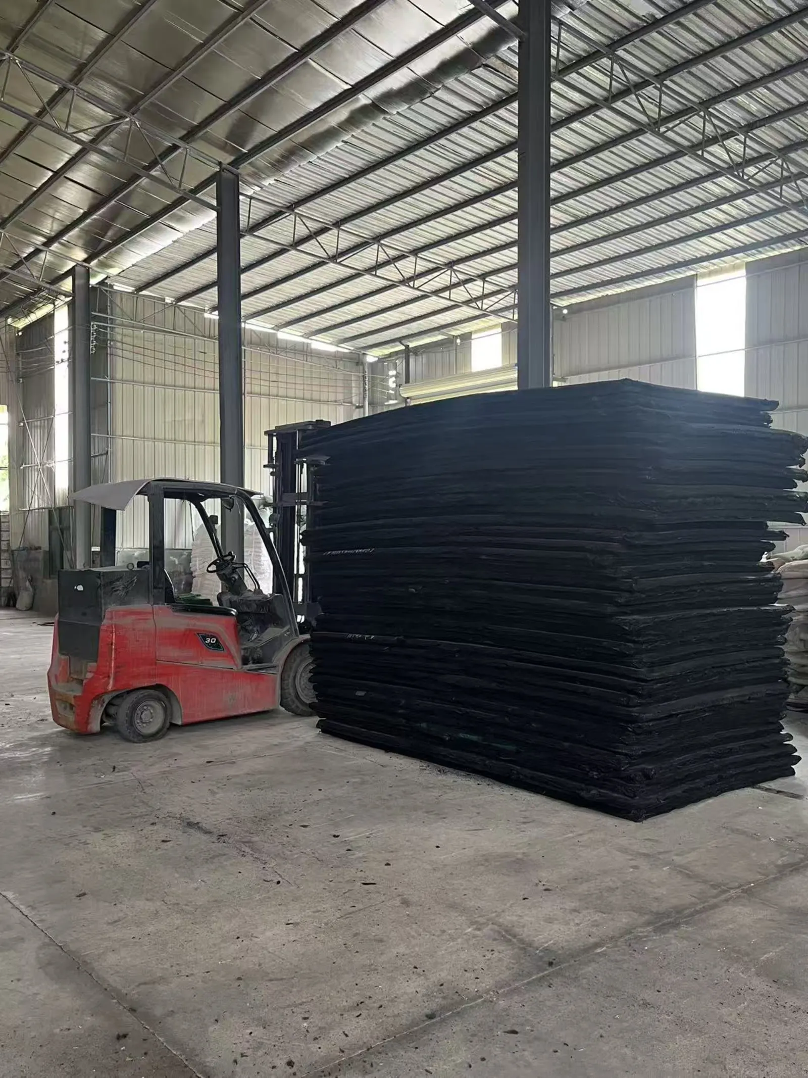 Black EVA foam slab storage and forklift handling